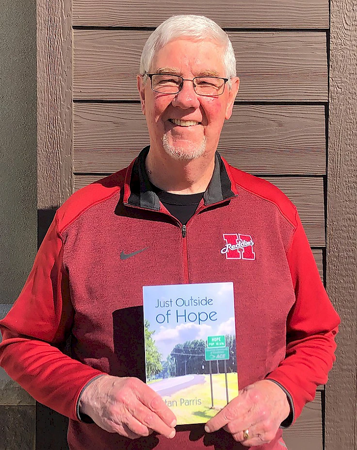 Stan Parris holding Just Outside of Hope by Stan Parris